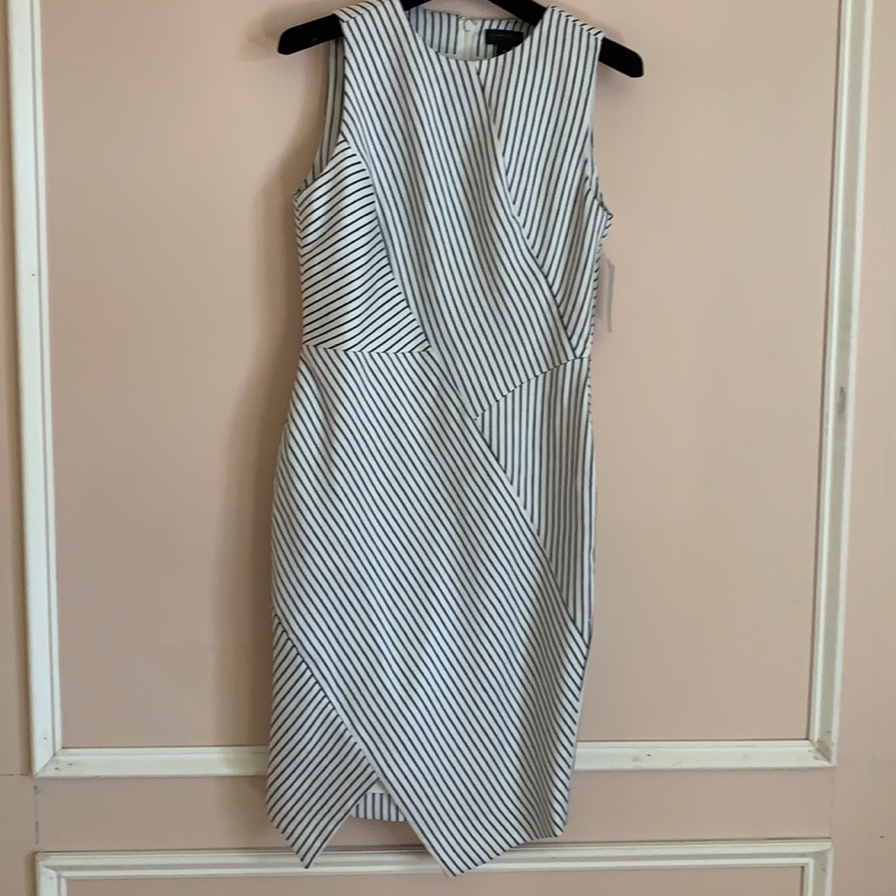 Asymmetrically sewn dress in navy and white by Carlisle Collection.